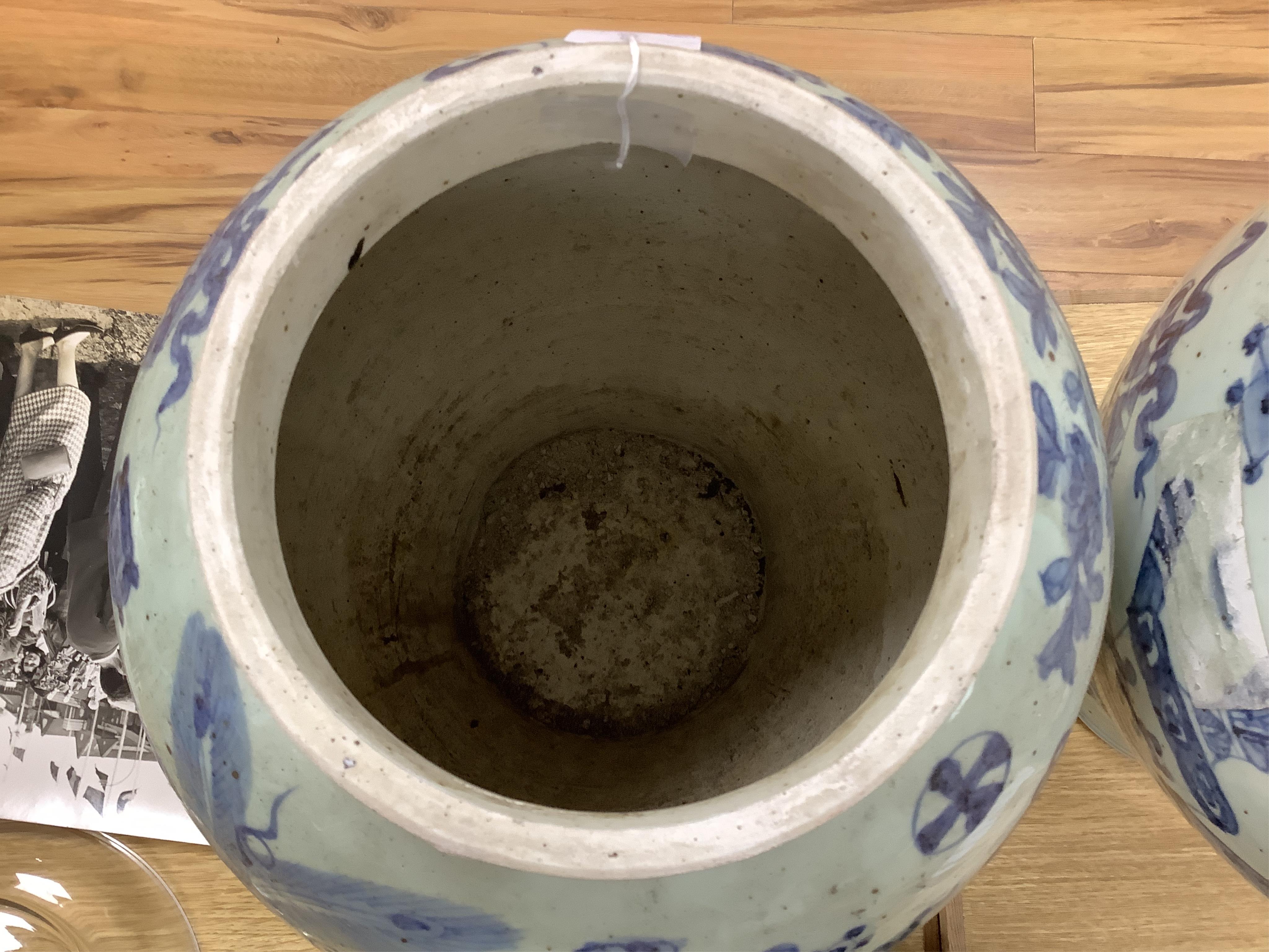 A large pair of Chinese blue and white ginger jars and covers, 54cm high. Condition - fair to good